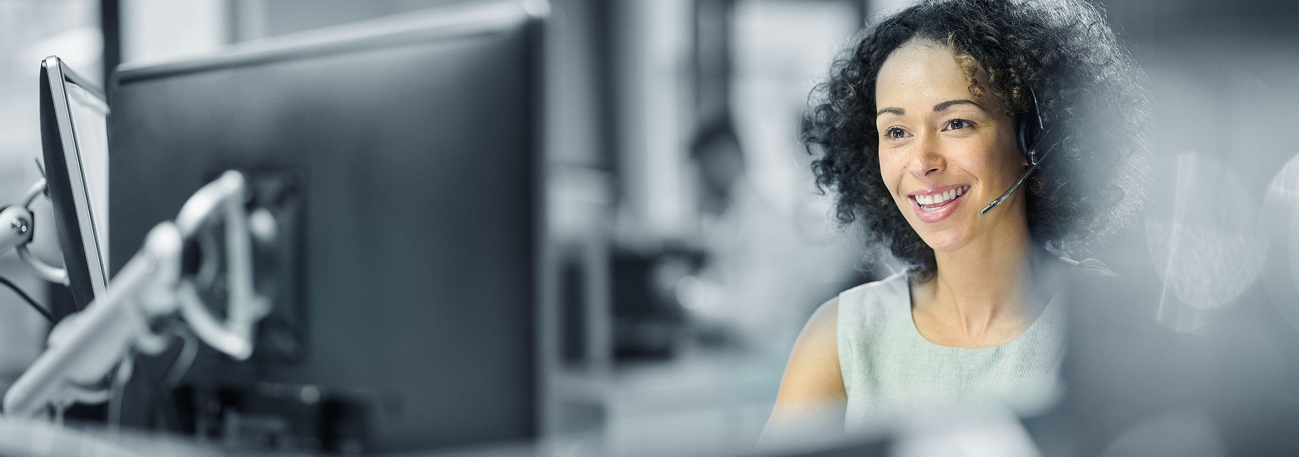 Concorde Distribution LTL professional working on computer with headset in London office