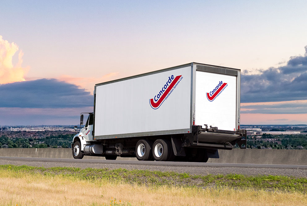Concorde LTL straight truck driving on Ontario highway during sunset